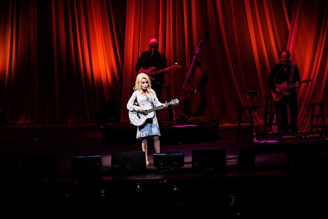 A photo of Dolly Parton performing.